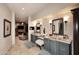 Dual vanity bathroom featuring custom cabinetry, unique fixtures, and modern lighting at 8406 E Calle Buena Vis, Scottsdale, AZ 85255
