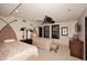 Comfortable bedroom with two beds, ceiling fan, and window with dark shutters at 8406 E Calle Buena Vis, Scottsdale, AZ 85255