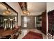 Inviting foyer featuring a grand mirror and a stylish entry table with candle decor at 8406 E Calle Buena Vis, Scottsdale, AZ 85255
