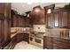 Modern kitchen features custom cabinets, granite countertops, and stainless steel appliances at 8406 E Calle Buena Vis, Scottsdale, AZ 85255