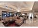 Spacious living room with brick ceiling and sliding doors, seamlessly connecting indoor and outdoor living at 8406 E Calle Buena Vis, Scottsdale, AZ 85255