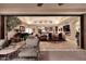 Open-concept living room with sliding glass doors leading to an outdoor patio space at 8406 E Calle Buena Vis, Scottsdale, AZ 85255