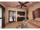 Spacious living room with ceiling fan, a bar, and comfortable seating area at 8406 E Calle Buena Vis, Scottsdale, AZ 85255