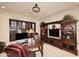 Office with wooden desk and cabinets, chair, shutters and many decorative items at 8406 E Calle Buena Vis, Scottsdale, AZ 85255