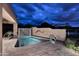 Backyard with a pool, decorative wall, mature landscaping, and stone paver surround at 8406 E Calle Buena Vis, Scottsdale, AZ 85255