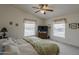 Welcoming bedroom boasts ample natural light, creating a serene and inviting atmosphere at 890 E Tee St, San Tan Valley, AZ 85140