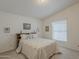 Cozy bedroom with a queen-sized bed and a window with natural light at 890 E Tee St, San Tan Valley, AZ 85140