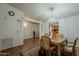 Inviting dining area with a seamless transition to a well-equipped kitchen, ideal for modern living at 890 E Tee St, San Tan Valley, AZ 85140