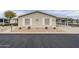 Cozy single-story home with desert landscaping, charming details, and covered parking space at 890 E Tee St, San Tan Valley, AZ 85140