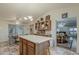 The lovely kitchen includes a kitchen island and breakfast nook with chairs at 890 E Tee St, San Tan Valley, AZ 85140