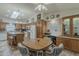 Open kitchen features an island, breakfast table, and a skylight overhead at 890 E Tee St, San Tan Valley, AZ 85140