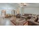 Cozy living room next to a dining area features hardwood floors, and neutral paint at 890 E Tee St, San Tan Valley, AZ 85140