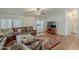 Cozy living room with hardwood floors, ceiling fan and a plush sectional at 890 E Tee St, San Tan Valley, AZ 85140