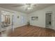 Spacious living room features hard wood flooring and a ceiling fan at 890 E Tee St, San Tan Valley, AZ 85140