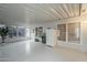 Bright sunroom with windows, a refrigerator, and a plant at 890 E Tee St, San Tan Valley, AZ 85140
