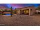 Beautiful backyard featuring a pool, patio, and desert landscaping, creating a private and serene outdoor oasis at 9604 S 183Rd Dr, Goodyear, AZ 85338