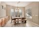 Bright dining room features tile flooring, neutral walls, and natural light at 9604 S 183Rd Dr, Goodyear, AZ 85338