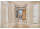 Inviting foyer featuring tile flooring, neutral walls, and an attractive front door at 9604 S 183Rd Dr, Goodyear, AZ 85338