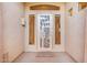 Close up of the front entrance with a sunburst designed security door and patterned door mat at 9604 S 183Rd Dr, Goodyear, AZ 85338