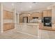 Well-lit kitchen with stainless appliances, granite counters, and ample cabinet space at 9604 S 183Rd Dr, Goodyear, AZ 85338