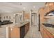Spacious kitchen with granite counters, stainless appliances, and a large center island at 9604 S 183Rd Dr, Goodyear, AZ 85338