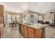 Well-lit kitchen with an island, stainless steel appliances, and an open concept design at 9604 S 183Rd Dr, Goodyear, AZ 85338