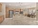 Open kitchen design with stainless steel appliances and a seamless connection to the dining area at 9604 S 183Rd Dr, Goodyear, AZ 85338