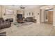 Spacious living room features a fireplace, tile floors, and neutral walls at 9604 S 183Rd Dr, Goodyear, AZ 85338