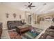 Open living room with tile floors and seamlessly connected kitchen at 9604 S 183Rd Dr, Goodyear, AZ 85338