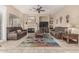 Cozy living room features a fireplace, tile floors, and neutral walls at 9604 S 183Rd Dr, Goodyear, AZ 85338
