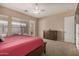 Spacious main bedroom with closet and dresser on carpeted floors at 9604 S 183Rd Dr, Goodyear, AZ 85338