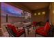 Inviting covered patio with comfortable seating, providing a relaxing outdoor space for enjoying the desert scenery at 9604 S 183Rd Dr, Goodyear, AZ 85338