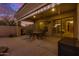 Beautiful covered patio with outdoor seating area offering seamless indoor-outdoor living and entertaining options at 9604 S 183Rd Dr, Goodyear, AZ 85338