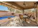 Cozy covered patio with outdoor dining area and built-in grill, perfect for enjoying outdoor meals and entertaining guests at 9604 S 183Rd Dr, Goodyear, AZ 85338