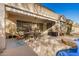 Inviting covered patio with an outdoor dining area, providing a perfect space for entertaining and enjoying the desert climate at 9604 S 183Rd Dr, Goodyear, AZ 85338