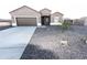 Charming single-story home with desert landscaping and a two-car garage at 10005 W Mission Dr, Arizona City, AZ 85123
