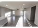 Open-concept living room with wood-look floors and plenty of natural light at 10005 W Mission Dr, Arizona City, AZ 85123
