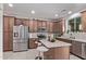 Modern kitchen featuring stainless steel appliances, light countertops, and sleek cabinetry at 10162 E Theorem Dr, Mesa, AZ 85212