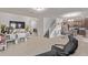 Bright, open-concept living area with tile floors, seamlessly connecting the living room, dining area and kitchen at 10162 E Theorem Dr, Mesa, AZ 85212