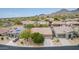 Aerial view of a residential community in a desert landscape with mountain views at 10796 E Betony Dr, Scottsdale, AZ 85255