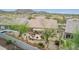 An eye-level view of an outdoor living space that features desert landscaping and outdoor seating, backed by mountain views at 10796 E Betony Dr, Scottsdale, AZ 85255