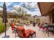 Backyard patio with multiple seating arrangements and desert landscaping features at 10796 E Betony Dr, Scottsdale, AZ 85255