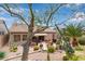 Spacious backyard featuring a covered patio, mature trees, and a serene outdoor living space at 10796 E Betony Dr, Scottsdale, AZ 85255