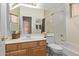 Bathroom featuring a single sink vanity, toilet, and a shower-tub combination at 10796 E Betony Dr, Scottsdale, AZ 85255
