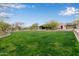 Beautifully landscaped community grounds featuring lush green lawn, mature trees, and walking paths at 10796 E Betony Dr, Scottsdale, AZ 85255