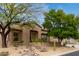Inviting front yard with desert landscaping and charming facade, creating a warm welcome at 10796 E Betony Dr, Scottsdale, AZ 85255