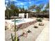 A landscape-level view of a hot tub area that features desert landscaping and stone construction at 10796 E Betony Dr, Scottsdale, AZ 85255