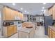 Well-lit kitchen with island and breakfast bar, offering ample counter space and modern appliances at 10796 E Betony Dr, Scottsdale, AZ 85255
