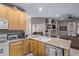 Bright, open-concept kitchen with stainless steel dishwasher and view of the living room at 10796 E Betony Dr, Scottsdale, AZ 85255