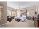 Serene main bedroom with a ceiling fan, bright windows, and comfortable seating area, creating a calming retreat at 10796 E Betony Dr, Scottsdale, AZ 85255
